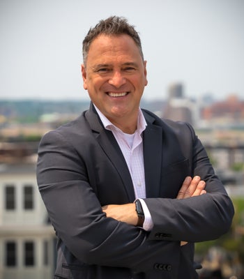 Portrait of John Collins, Principal/Sales Agent.